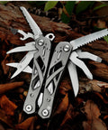 Everyday Carry 15 In 1 EDC Multitool Pliers with spring-assisted pliers and hollow skeleton design on forest background.