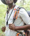Hiker wears Built Tough Paracord Neck Lanyard Keychain For Everyday Carry Outdoor Survival Ready With HK Clip And Key Ring.