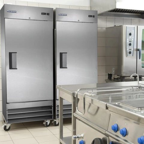 Go Big Commercial Reach In Freezer With 23 Cubic Feet Of Beefy Storage Straight Up Frost Free Operation And Rugged Stainless Steel Cabinet in a kitchen.