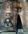 Top Shelf 58mm Pressurized Filter Basket Stainless Steel Double Wall Espresso Portafilter replacement cup displayed with portafilter.
