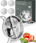 4 Disc Stainless Steel Food Mill With Ergonomic Hand Crank For Tomato Sauce Canning Applesauce Baby Food Mashed Potatoes Puree And Jams A Pro Grade All In One Kitchen Tool For Precise Texture Control And Smooth Results; food mill with 4 discs and hand crank shown near tomatoes and basil with packaging box in background.