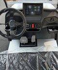Interior view of Six Seater Electric Leisure Cart With Premium Upholstered Interior And Beefy All Terrain Tires showing dashboard, pedals, and controls.