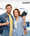 Couple at airport holding Must Have Passport Wallet With Magnetic Button Closure For Travel Essentials A Sleek Black Passport Book Holder For Women And Men Easy Access To Passports And Documents Travel Must Haves.