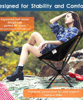 Person sitting in ergonomic Lightweight Portable Folding Camping Chair With 360 Degree Rotation, showing stability on rocky terrain.
