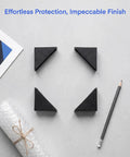 Plastic Triangle Edge Corner Protectors Pack Of 100 Pcs 1.89 X 1.89 X 0.71 Inch on a table with pencil and bubble wrap