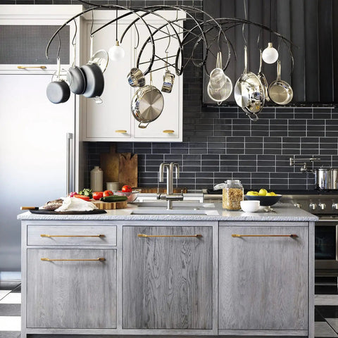 Modern kitchen with gray cabinets featuring Six Pack Oval Antique Brass Cabinet Knobs Set For Drawers And Dressers, durable zinc alloy pulls.