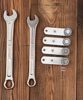 Buttery Smooth 4 Pack Sliding Door Pulley Wheels With Silent Rubber Bottom Rollers And Rock Solid Construction For Easy Side Mount Closet Barn Door Track Hardware Replacement and wrenches on wooden surface.