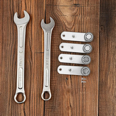 Buttery Smooth 4 Pack Sliding Door Pulley Wheels With Silent Rubber Bottom Rollers And Rock Solid Construction For Easy Side Mount Closet Barn Door Track Hardware Replacement and wrenches on wooden surface.