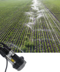 Stallion Grade Stainless Steel Brushless Submersible Pump 24V 440W functioning in a lush green field with sprinklers.