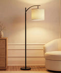 Arc Shaped LED Floor Lamp With Hanging Shade for living rooms and offices, sleek modern lighting, black, marble base in a cozy room.