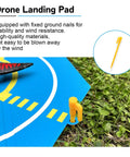On The Go Foldable Night Vision Drone Landing Pad 20 Inch Double Sided Waterproof Helipad with orange ground nail on grass