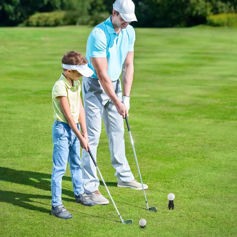 Golf Simulator Tees 24 Piece Practice Kit With 12 Tall And 12 Short Tees shown on grass with two golfers practicing