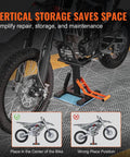 Heavy Duty Dirt Bike Lift Stand With 440 Lb Capacity And Hydraulic Lift under a dirt bike on a garage floor