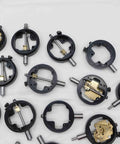 Assorted Dial Test Indicator Spare Parts Bundle Plug And Play For Precision Machine Repair Featuring Rock Solid Replacement Gears Dials And Workbench Hardware Pack. Close-up of precision gauge components, black metal housing with brass fittings.