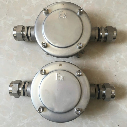 Two front-view explosion-proof junction boxes, 316 stainless steel, Ex marked, M201.5 NPT threads.