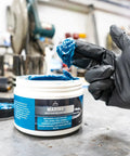 Gloved hand using Go-To Premium Mineral Base Marine Grease With Water-Resistant Formula, Heavy-Duty Lubricant, 16 oz tub