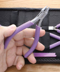 Hand holding pliers from 8 Piece Beading Pliers Set with Color Coordinated Tools and Orchid Leather Case for Jewelry Making