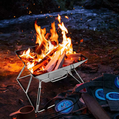 Folding Campfire Grill For Camping And Backpacking Portable Charcoal Fire Pit With 304 Stainless Steel Construction in use outdoors