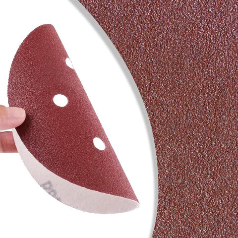 Close-up of a 210 Piece 5 Inch 8 Hole Sanding Discs Set For Random Orbital Sander Hook And Loop Sandpaper shown held, highlighting texture.