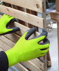 Crinkle Latex Coated Safety Work Gloves For Men And Women Unisex Multi Use Grippy Gloves For Construction Warehouse Gardening Landscaping Assembly All Day Comfort Breathable Knit Liner Large Green 12 Pairs being used on wood slats