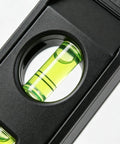 Close-up of a 3 bubble acrylic vial in the Magnetic Torpedo Level 6 Inch, 3 Bubble Spirit Measuring Tool.