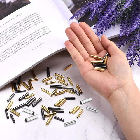 Heavy Duty Metal Shoelace Aglets 40 Pack Silver Copper Lace Tips in hand, showcasing various colors and styles for shoe repair.