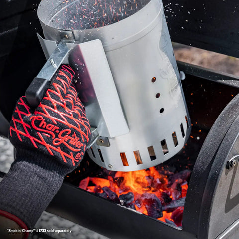 Person using Chimney Style Charcoal Grill Starter with Quick Release Trigger to light coals in a BBQ grill, 12 inch size