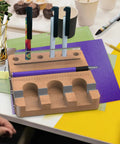 Wooden organizer holding pens with Dope Sublimation Pen Clamp For 0.4 Inch Pens Silicone Grip Holder for crafting projects.