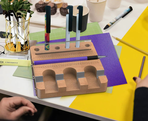 Wooden organizer holding pens with Dope Sublimation Pen Clamp For 0.4 Inch Pens Silicone Grip Holder for crafting projects.