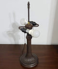 Vintage Tiffany Style Stained Glass Table Lamp 22 Inch Tall without shade showcasing base on wooden surface