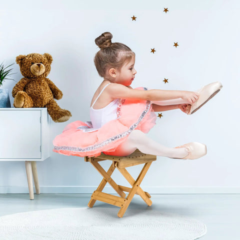 Child sitting on Foldable Shower Stool For Tiny Bathrooms Bamboo Foot Rest And Shaving Stool Space Saver Portable Folding Shower Bench