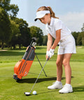 Girl using Kids Golf Club Set For Ages 6 To 8 With Stand Bag Right Hand Driver 7 8 Iron 9 P Iron Putter And Headcover on golf course