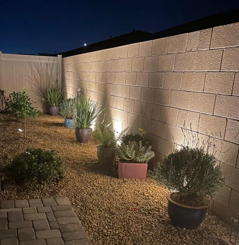 Low Voltage Landscape Well Lights 12W 12 To 24V AC DC In Ground Garden Lights illuminating potted plants along a pathway at night