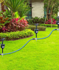 Rock Solid Motion Activated Yard Sprinkler With Adjustable 360 Spray Head in a lush green garden, featuring water hose setup.