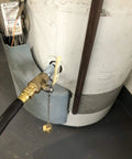 Turbo Flush Water Heater Drain Valve Kit with 3/4 in stainless steel nipple installed on a residential water heater.