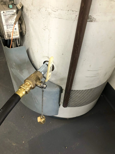 Turbo Flush Water Heater Drain Valve Kit with 3/4 in stainless steel nipple installed on a residential water heater.
