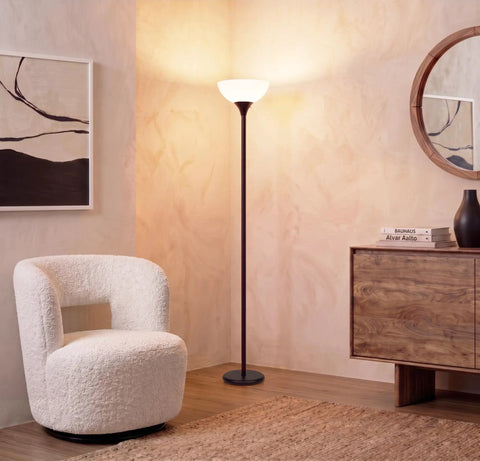 Sky Dome Dimmable LED Floor Lamp in Jet Black Finish illuminating living room with warm light, modern torch style lamp.