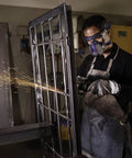 Worker using grinder, wearing Heavy Duty P100 Dust And Fume Respirator Mask For Industrial Use With All Day Comfort Shields Against Microorganisms