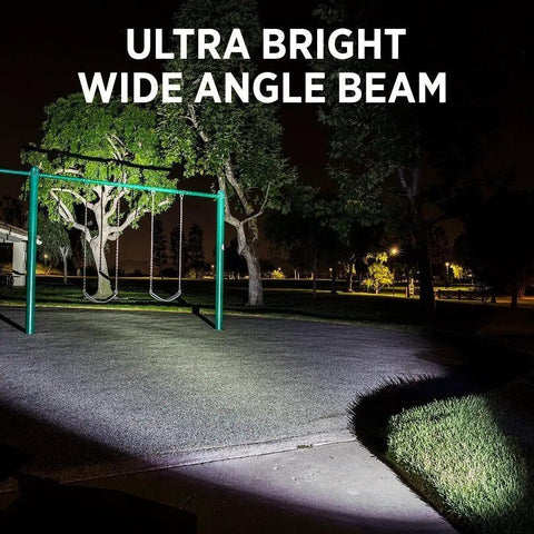 Dual Pack Tactical LED Flashlight S1000 T6 Upgraded Ultra Bright Zoomable Beam lighting up a park at night.