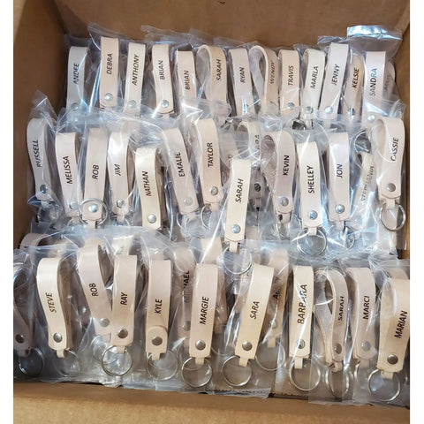 Premium Blank Natural Leather Keychains 10 Pack With Heavy Duty Metal Swivel Clasps, customizable with names.