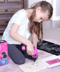 Girl using Girls Power Drill Set With Realistic Drilling Action 60 Piece Tool Kit Rechargeable Cordless Pink Drill With LED Light