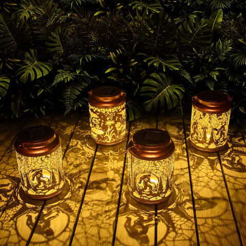 Four Boho Mosaic Solar Lanterns Outdoor Lights Blue Waterproof Table Lights For Garden Patio Yard, glowing warm on patio.