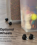 Two Pack Dog Food Storage Containers With Airtight Seal And Rolling Wheels Holds Up To 30 Lbs Each One Hand Open BPA Free Made In USA Clear And Black showing optional wheels with pet food