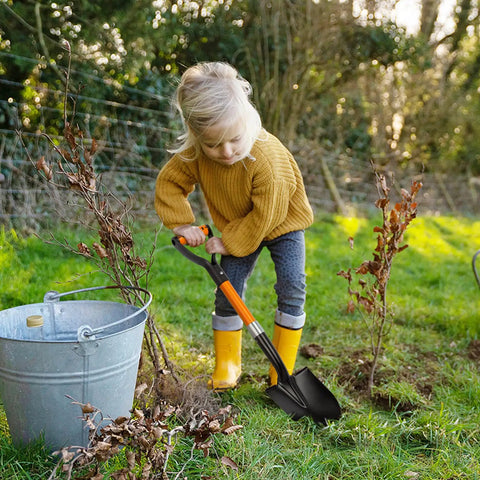 Child using 28 Inch Round Shovel With D Handle For Garden Beach Camp Use Fiberglass Handle Workhorse Tool For Transplanting.