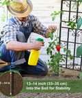 Gardener using 2 Pack Metal Garden Trellis for Climbing Plants, 6 Ft Tall by 20 In Wide, Rustproof Black Coating support.