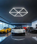Triangle Hexagon LED Ceiling Lights 12 Pack 710W 78,100LM Honeycomb Design in car showroom with luxury cars