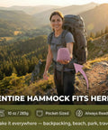Person holding packed Ultralight Camping Hammock With 600 Lb SGS Certified Capacity, Pack Light At Only 10oz Portable 20D Ripstop Nylon