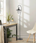 58 Inch Industrial Nautical Floor Lamp With Hanging Cage Shade, Brushed Pewter Finish in modern living room setting