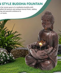 Chill Zen Buddha Outdoor Water Fountain 19 Inch Handcrafted Statue with LED lights, faux bronze finish in garden setting