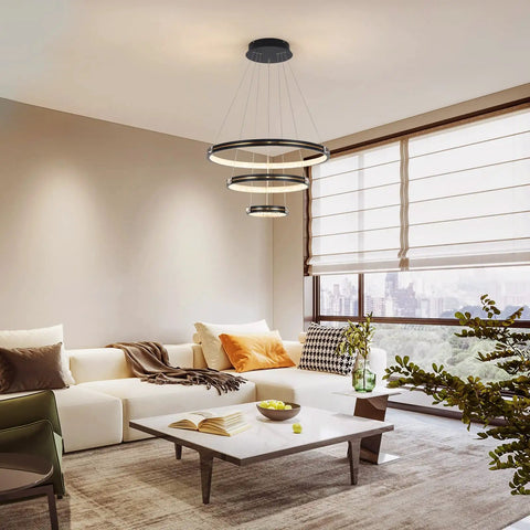 Three Ring Modern LED Pendant Light Dimmable Contemporary Chandelier in Black Acrylic 76W in a stylish living room setting.